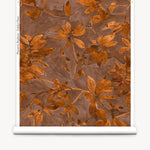 Roll of wallpaper with a floral pattern on a brown background