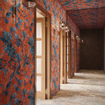  hallway with orange and blue floral patterned walls