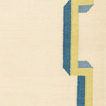 Flatweave rug with with blue and yellow geometric border  on a beige background