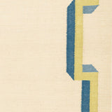 Flatweave rug with with blue and yellow geometric border  on a beige background