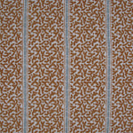 Printed fabric detail in a geometric rhythmic stripe in warm brown with a light blue accent