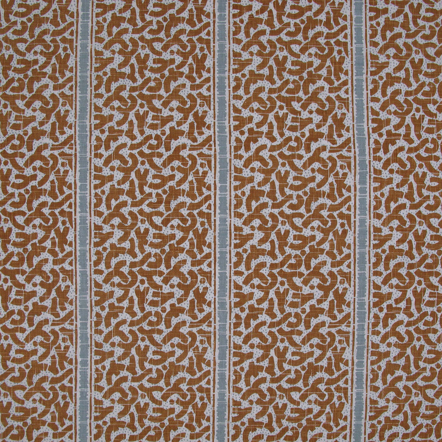 Printed fabric detail in a geometric rhythmic stripe in warm brown with a light blue accent