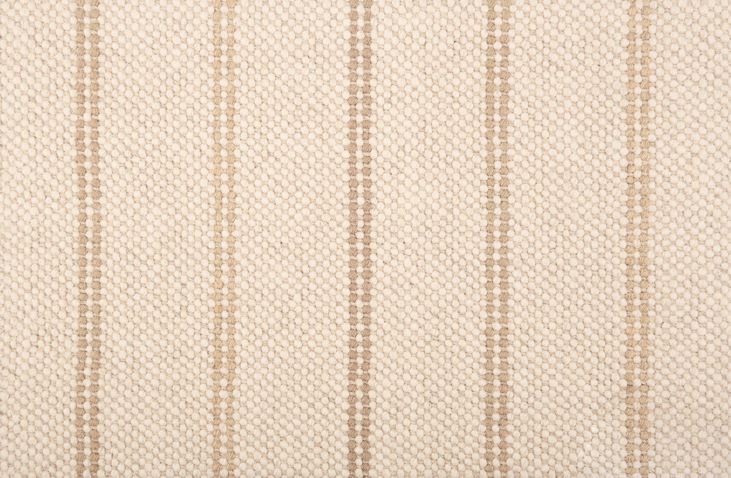 Broadloom carpet in a neutral with widely spaced stripes in shades of tan.