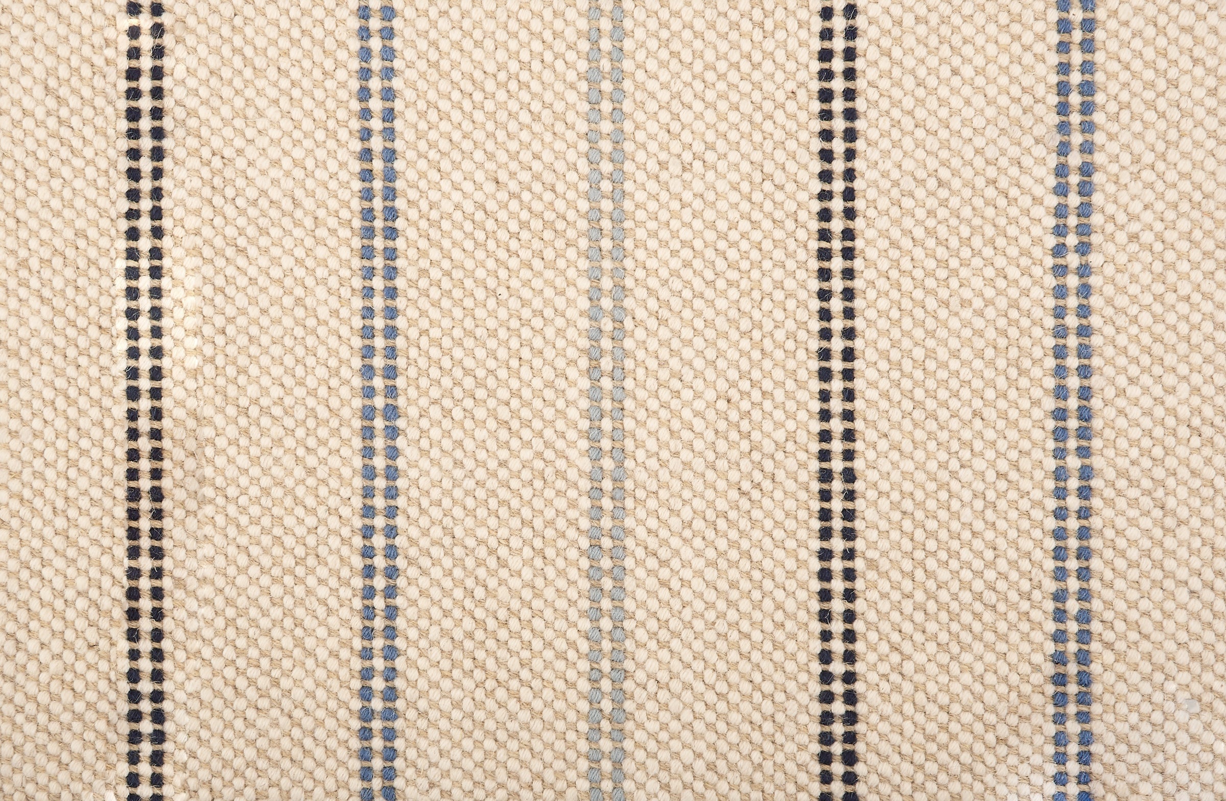 Broadloom carpet in a neutral with widely spaced stripes in shades of blue.