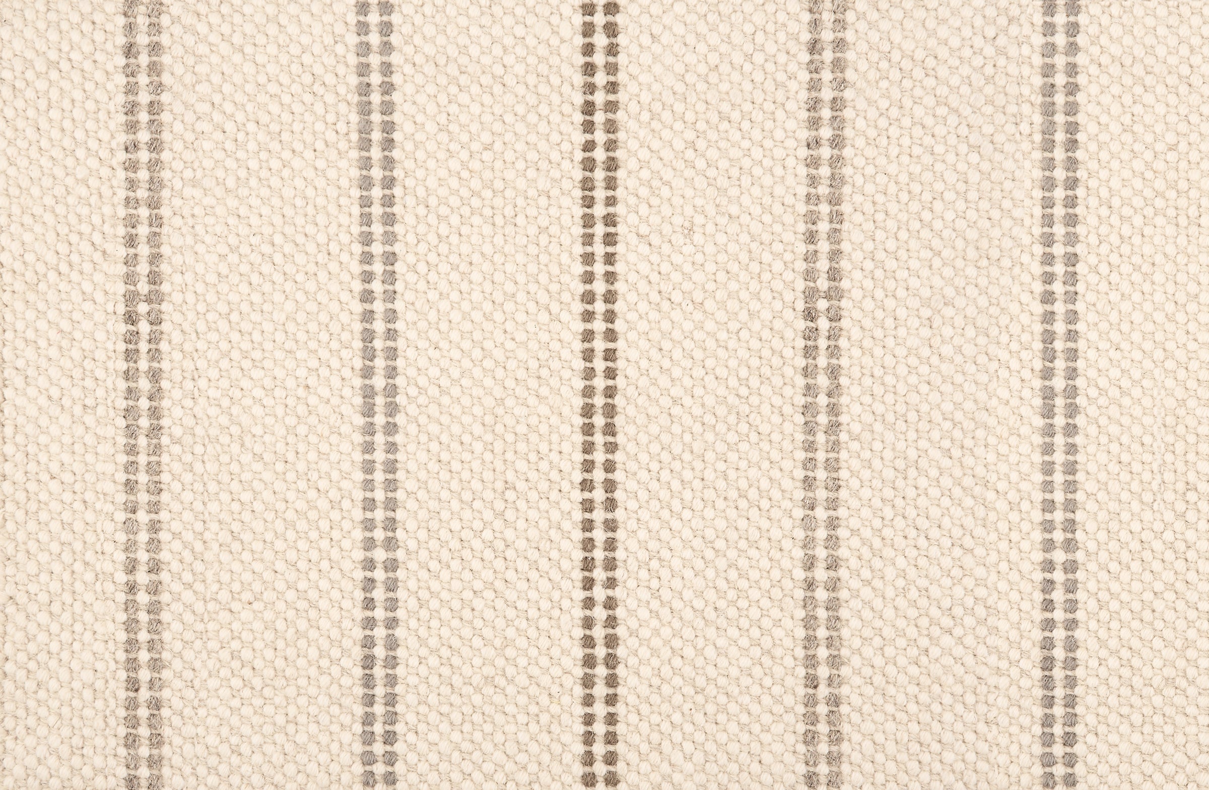 Broadloom carpet in a neutral with widely spaced stripes in shades of taupe.