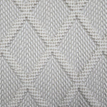 Broadloom carpet in a dimension diamond lattice in cream and light grey. 