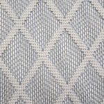 Broadloom carpet in a dimension diamond lattice in cream and slate blue.