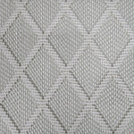 Broadloom carpet in a dimension diamond lattice in cream and grey-green