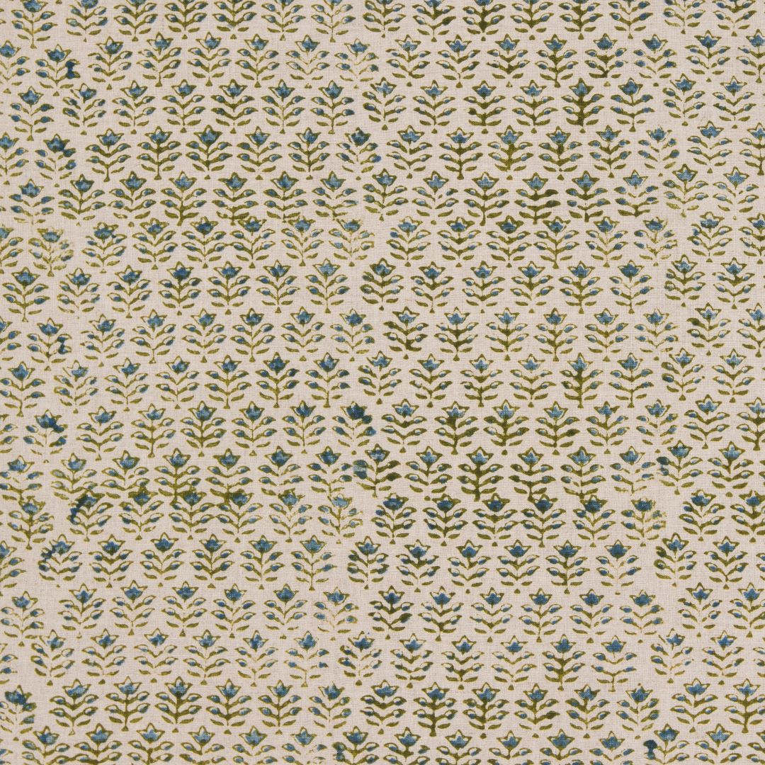 Detail of fabric in a small-scale floral grid print in blue and green on a cream field.