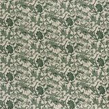 printed linen fabric in a carp and leaf pattern in green on a beige field.