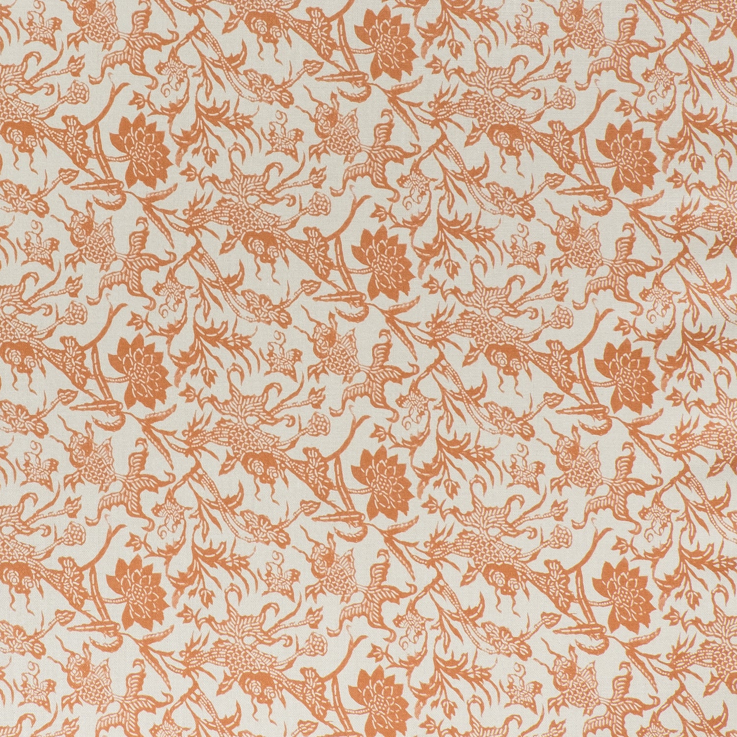 printed linen fabric in a carp and leaf pattern in orange on a beige field.