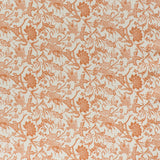 printed linen fabric in a carp and leaf pattern in orange on a beige field.