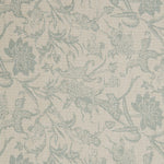 Detail of a linen fabric in a carp and leaf pattern in misty blue on a beige field.