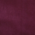 Detail of velvet fabric yardage in maroon.