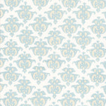 Detail of fabric in a repeating damask print in blue and yellow on a white field.