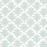 Detail of fabric in a repeating damask print in blue and yellow on a white field.