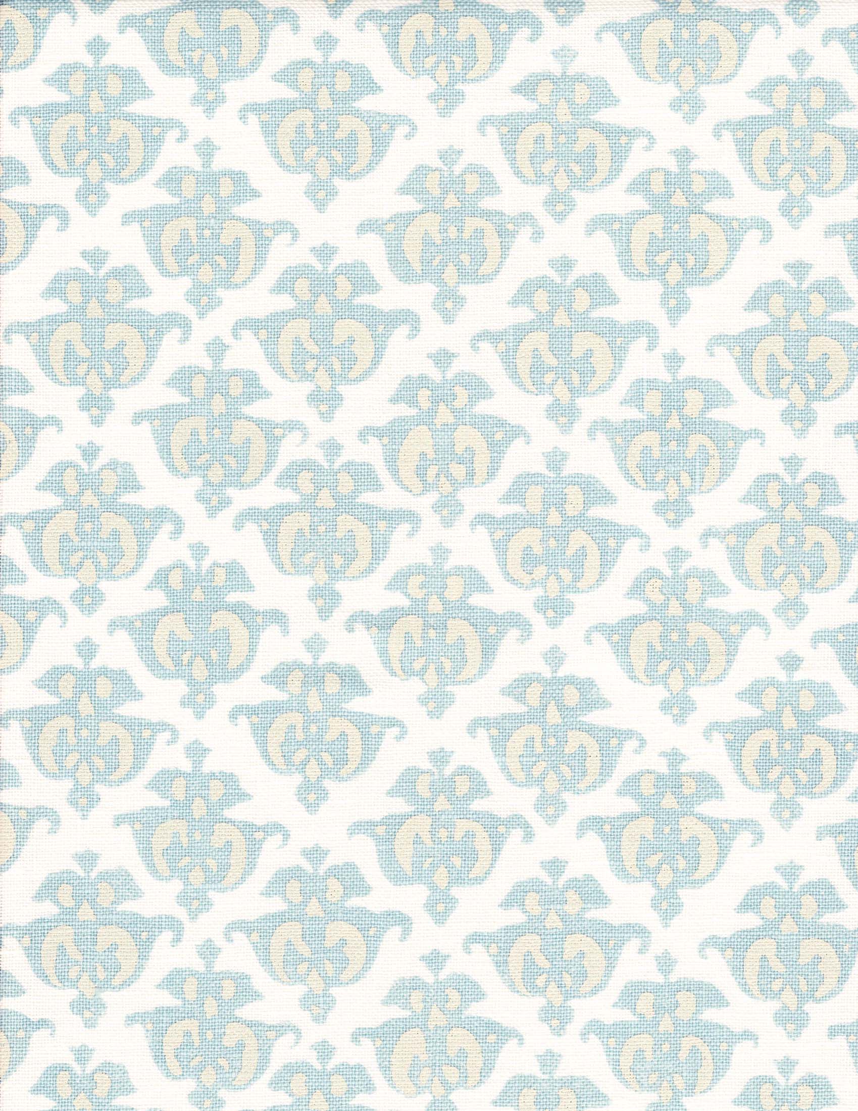 Detail of fabric in a repeating damask print in blue and yellow on a white field.