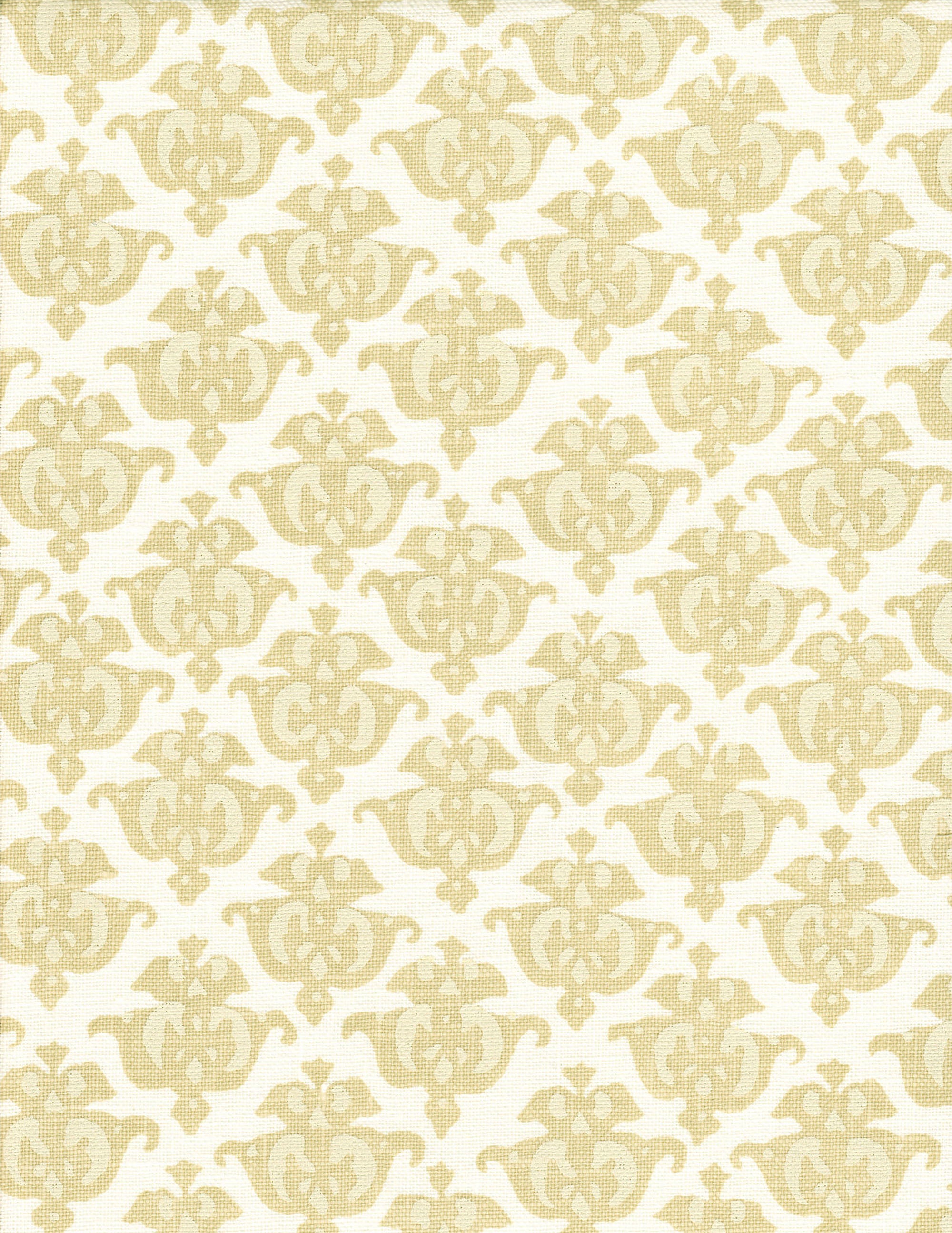 Detail of fabric in a repeating damask print in tan and cream on a white field.