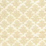 Detail of fabric in a repeating damask print in tan and cream on a white field.