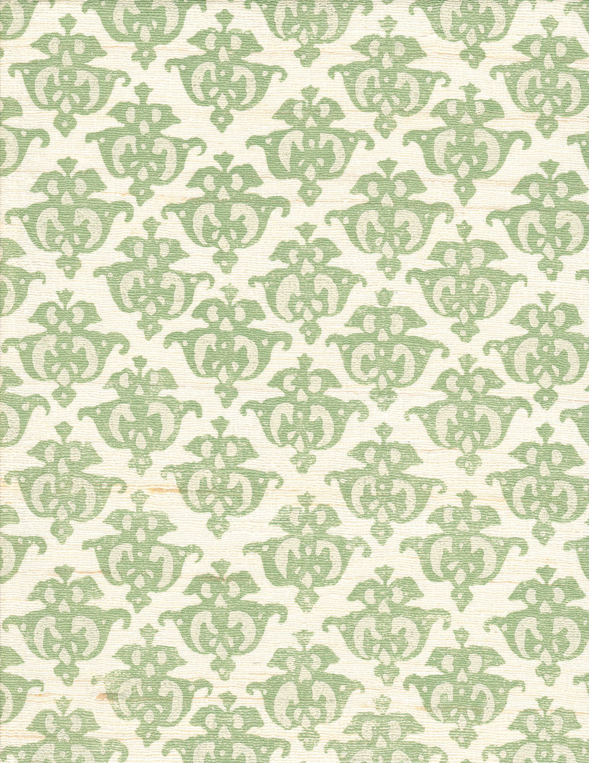 Detail of fabric in a repeating damask print in green and tan on a cream field.