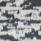 Detail of wallpaper in an abstract textural pattern in black, white and tan.