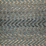 Handwoven rug detail in a contemporary zig zag design in slate and grey 