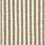 Textured area rug with vertical striped pattern on a neutral background