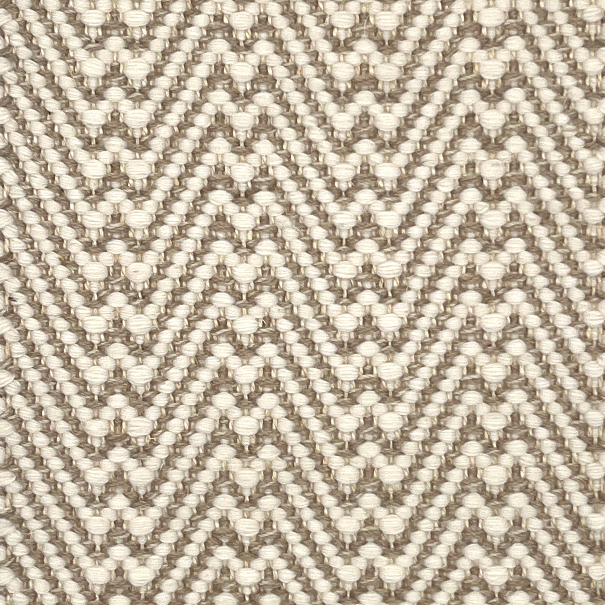 Flatweave rug with a zigzag pattern in beige and brown on a neutral background