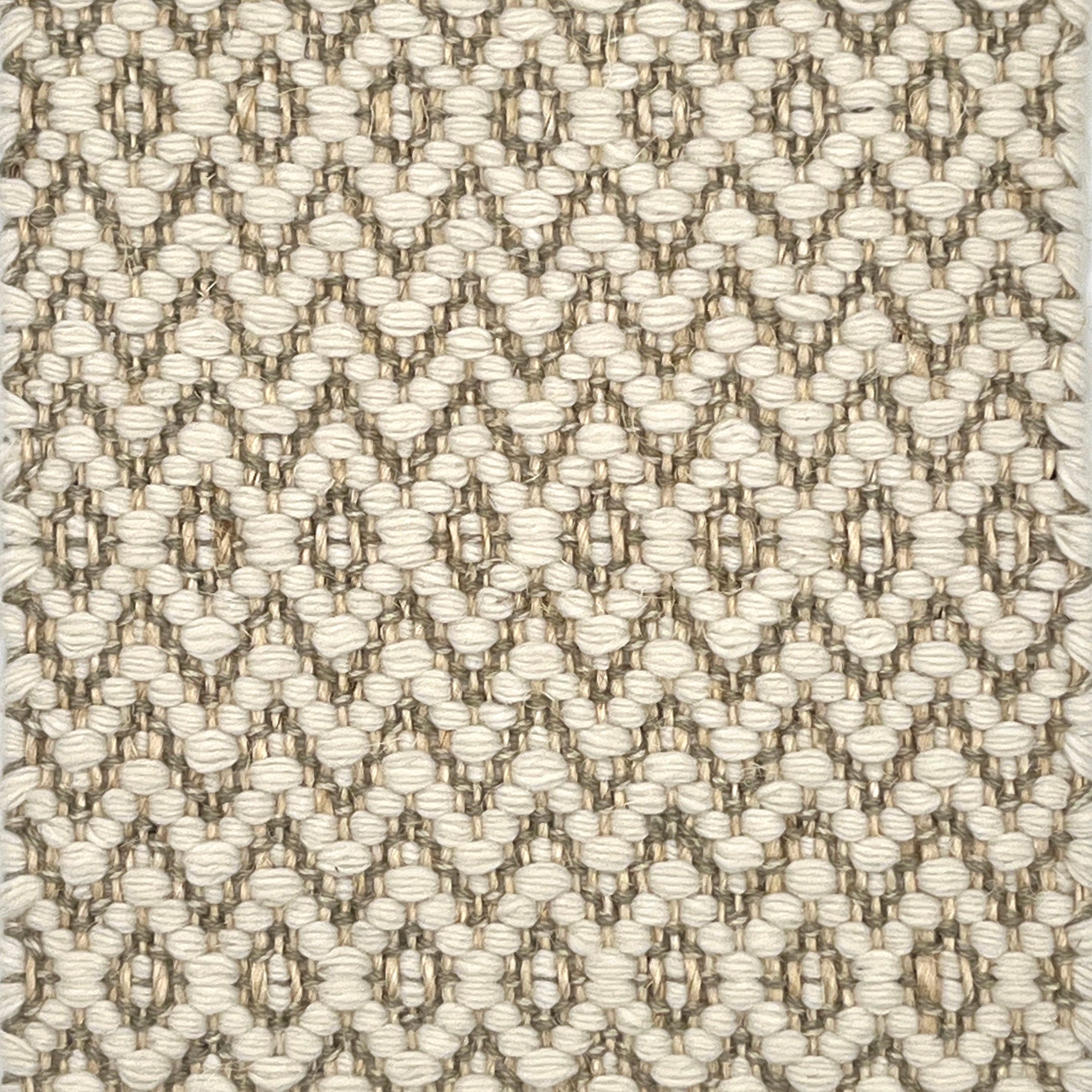 Textured flatweave rug with a diamond pattern in beige and brown tones.