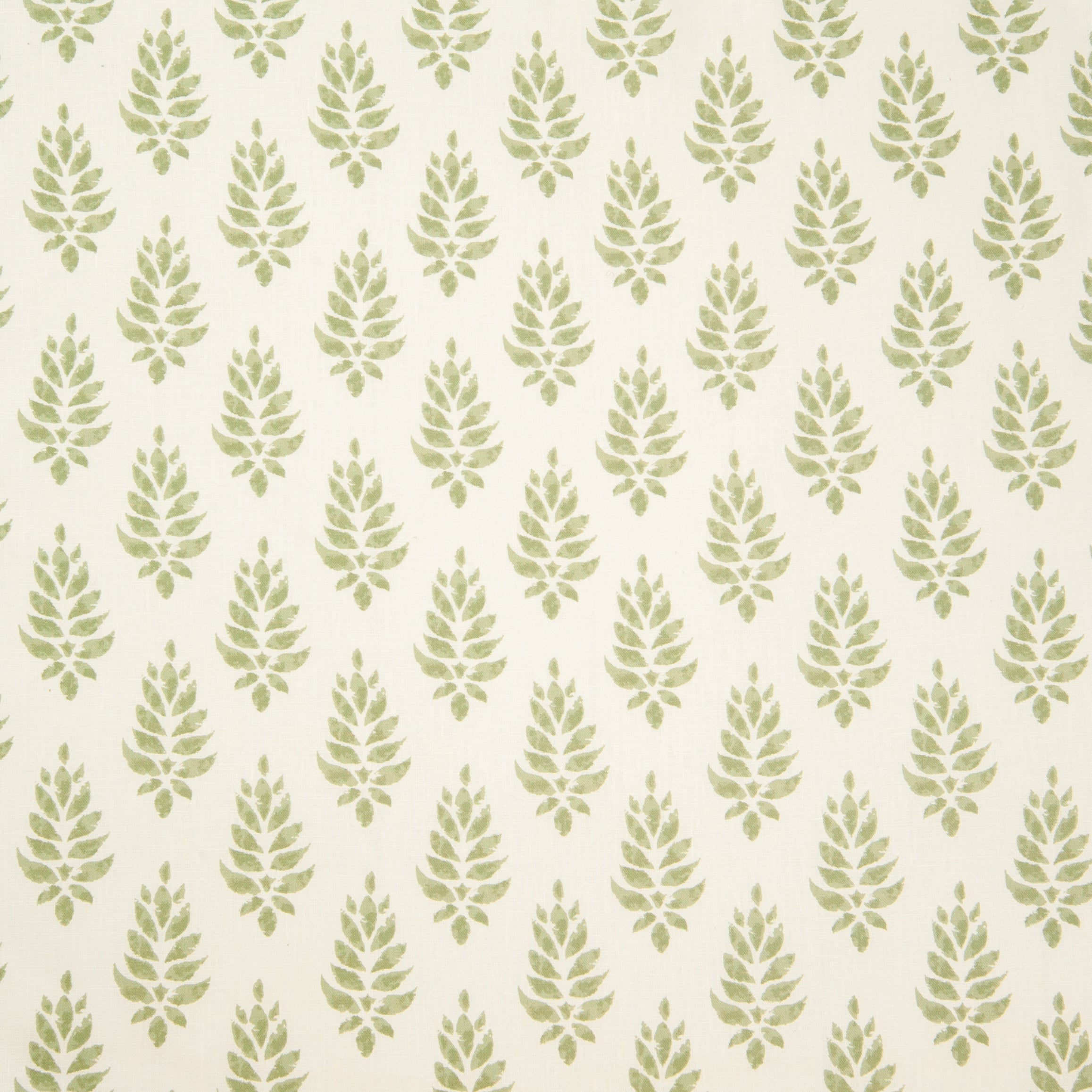 Detail of fabric in a repeating leaf pattern in light green on a cream field.