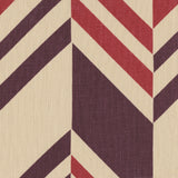 Detail of fabric in an irregular chevron stripe in red and purple on a cream field.