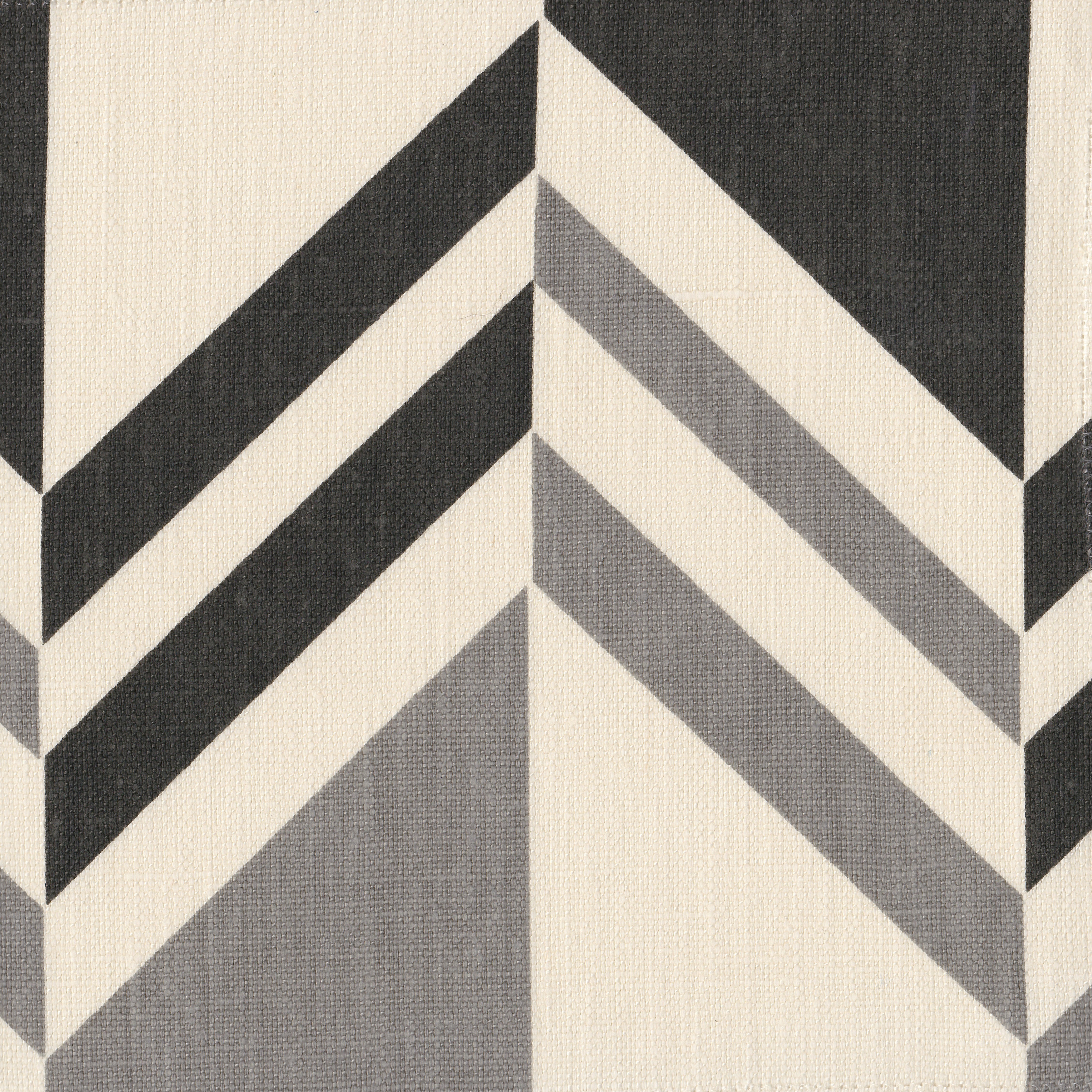 Detail of fabric in an irregular chevron stripe in gray and charcoal on a white field.