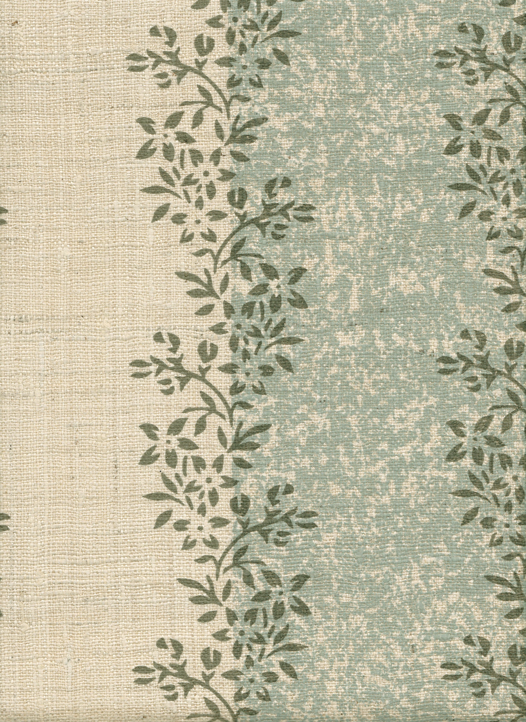 Detail of fabric in a botanical stripe print in shades of blue and dark green on a cream field.