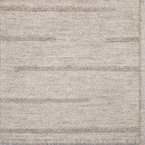 Textured ecru rug with a subtle pattern