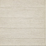 Close-up of a textured broadloom carpet with horizontal lines