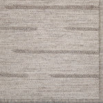 Textured rug with horizontal stripes in neutral colors
