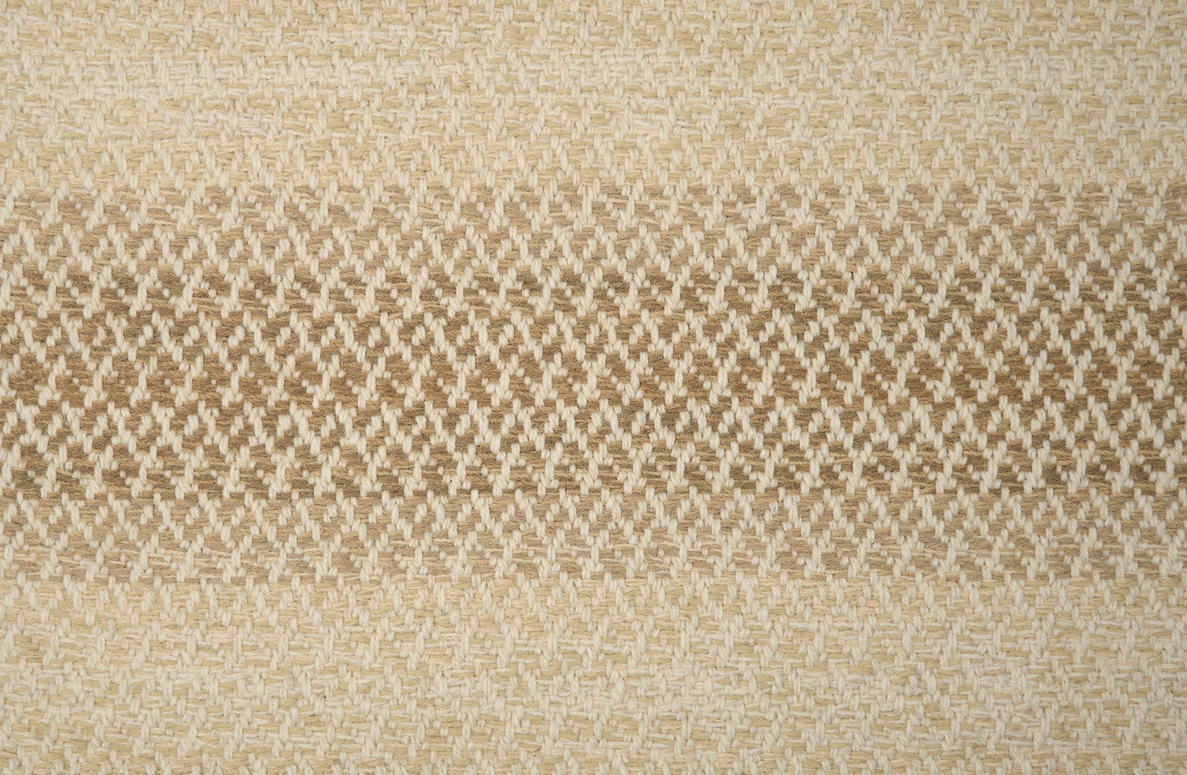 Textural broadloom with an ombré stripe in warm tan. 