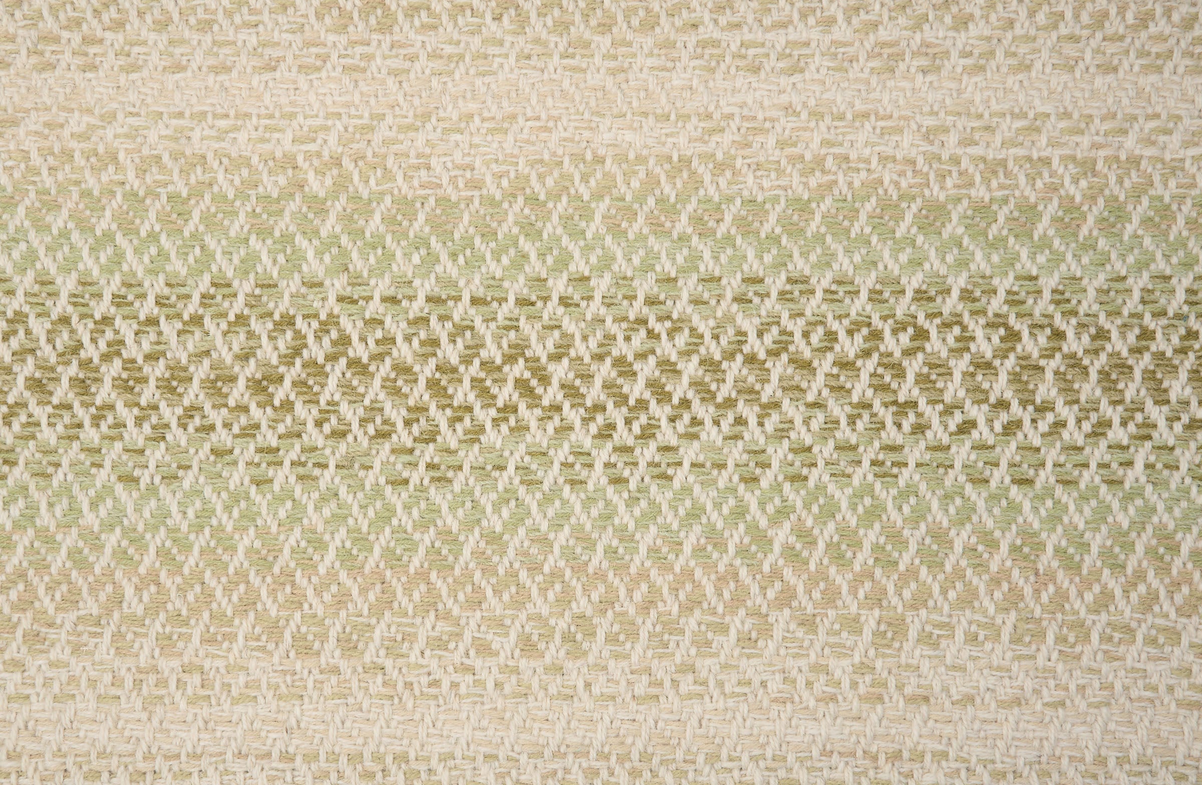 Textural broadloom with an ombré stripe in green and beige.