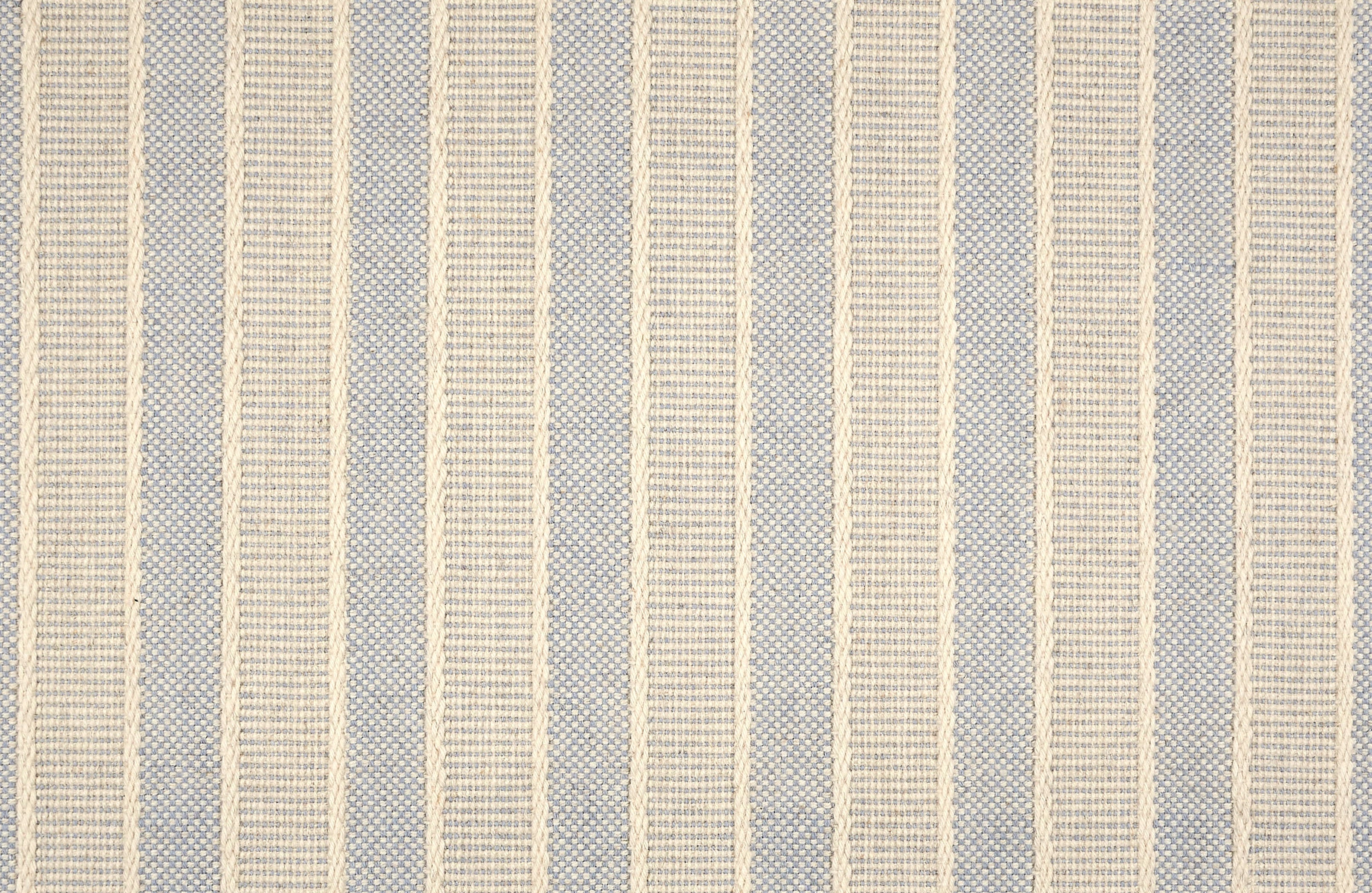 Broadloom carpet in cream and blue stripes.