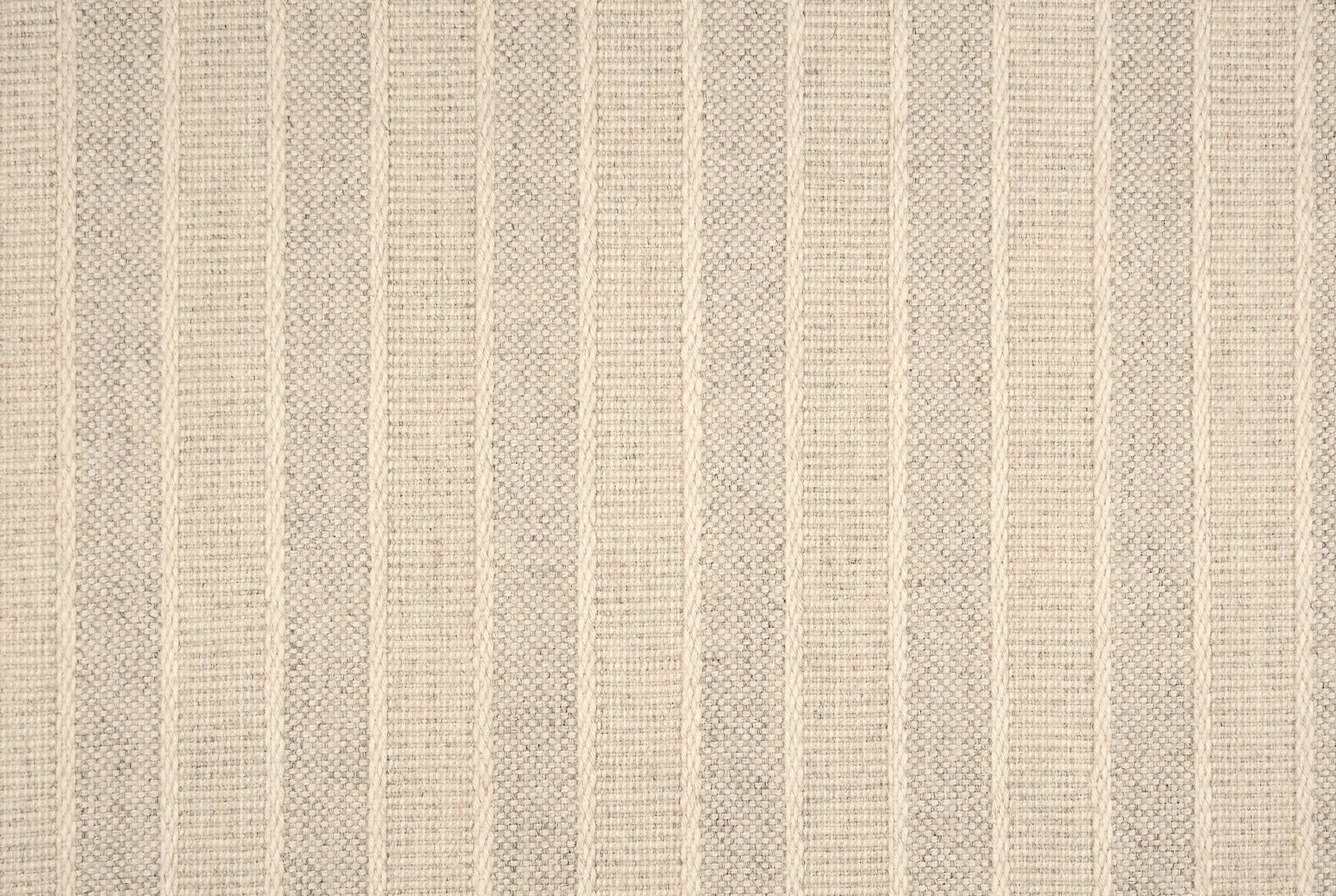 Broadloom carpet in cream textural stripes.