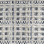 Broadloom carpet in check pattern in shades of blue with cream. 