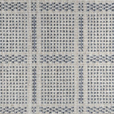 Broadloom carpet in check pattern in shades of blue with cream. 