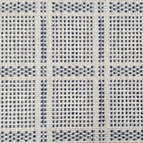 Broadloom carpet in check pattern in shades of dark blue with cream. 