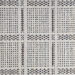 Broadloom carpet in check pattern in shades of brown and blue with cream. 