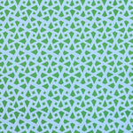 Detail of fabric in a geometric lattice print in green on a light blue field.