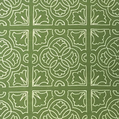 Detail of fabric in a damask lattice print in white on a green field.