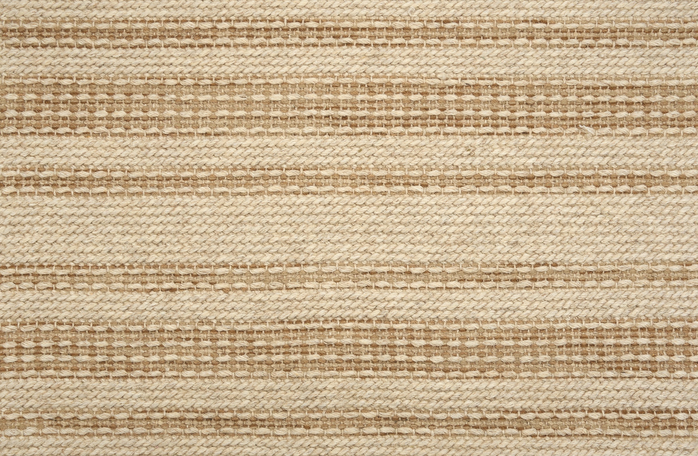 Broadloom carpet in beige with brown stripes.