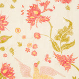 Detail of fabric in a bird and botanical print in shades of red and yellow on a cream field.