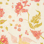 Detail of wallpaper in a bird and botanical print in shades of red and yellow on a cream field.