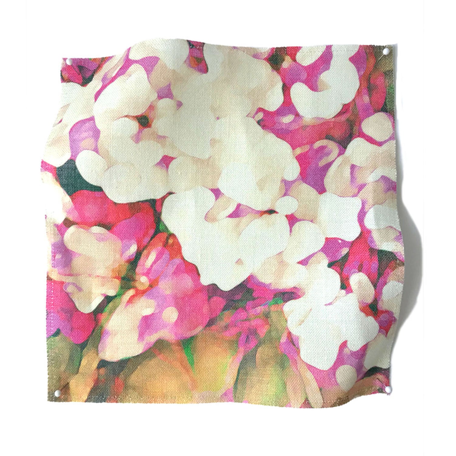 Square fabric swatch in an abstract floral print in technicolor shades of pink, cream and green.
